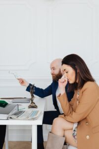 Professional discussion in an office setting involving legal matters.